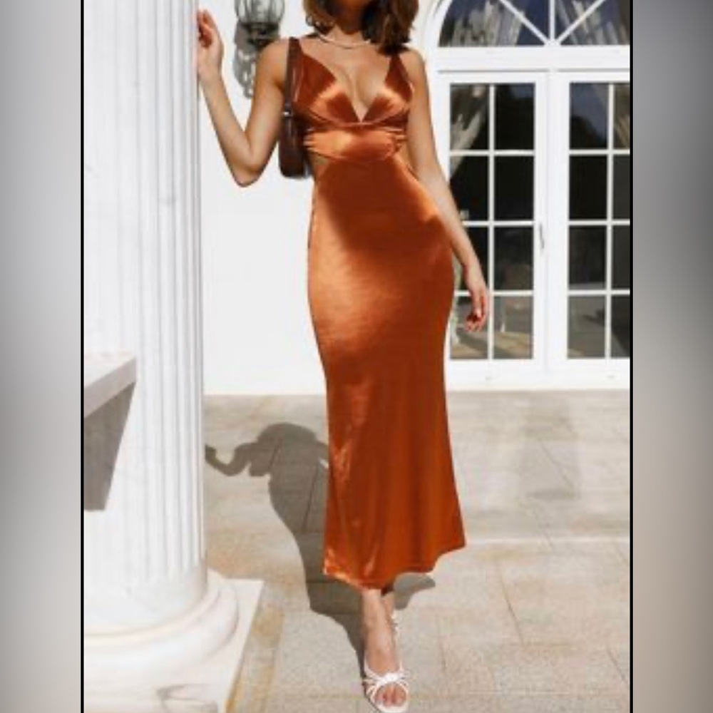 Midi, satin fabric. Open back with Adjustable shoulder straps.